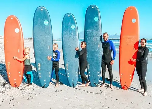 Awesome family surfing lesson at Bloubergstrand Beach